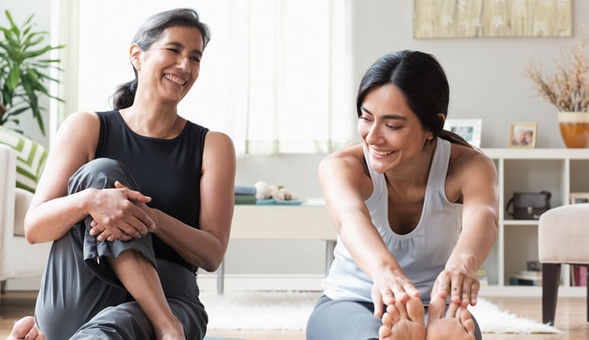 Two women stretching